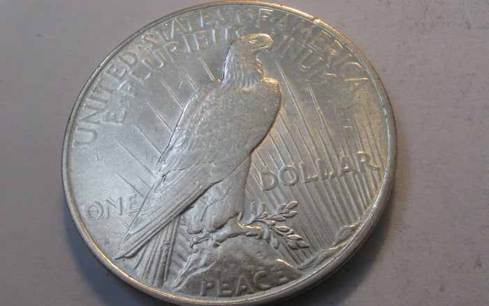 1927-D Peace Dollar. AU-55 | Of Coins & Crystals