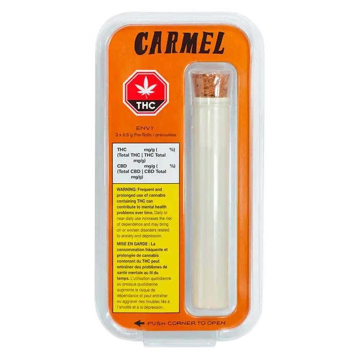 Top-down studio shot of the Carmel Envy PR 3 x 0.5 g blister pack showing an orange backing, THC symbol, and a cork-sealed tube.