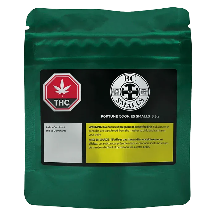 Front-facing shot of a metallic green pouch labeled "Fortune Cookies Smalls" with a black product panel, THC symbol, BC Smalls logo, and a yellow warning box.