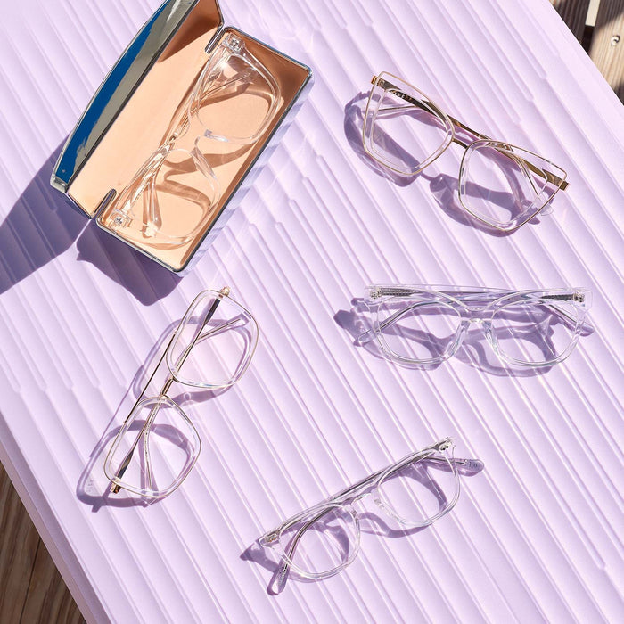 still life of diff eyewear clear crystal prescription glasses featuring the becky iv, bella, bella xs, jaxson, maxwell and winston glasses