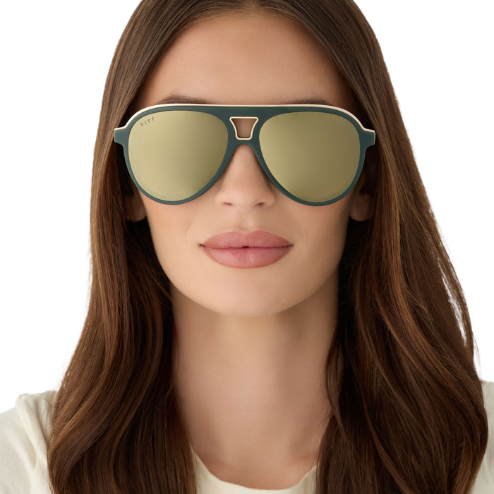 on model - female wearing diff eyewear featuring the tosca iii aviator sunglasses with a fairway green acetate with gold accentsframe and aloe green gradient w/ light gold flash lenses front view