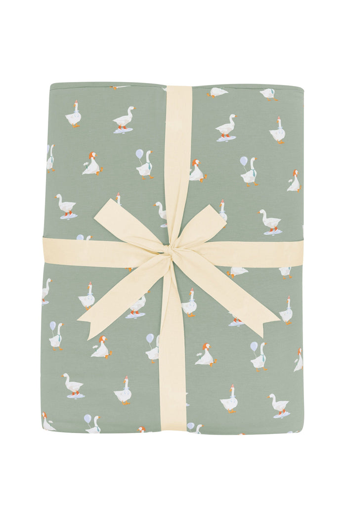 Product photo of the Youth Blanket in Silly Goose 2.5 shown wrapped in its bow packaging