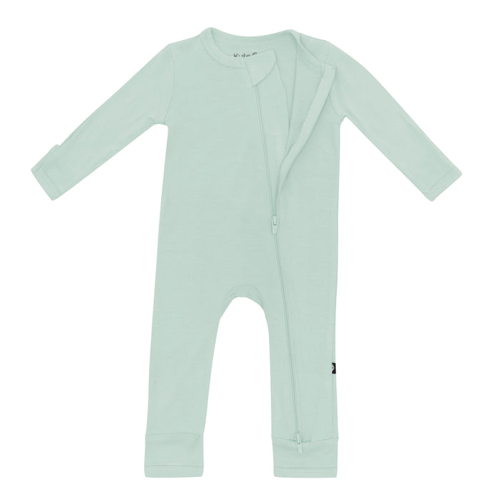 Partially unzipped dual zipper on Zippered Romper in Sage