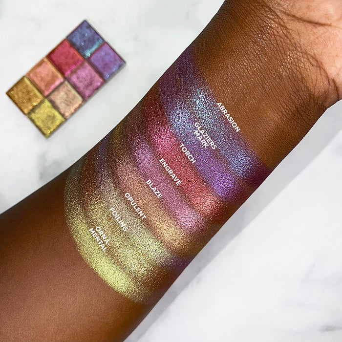 Top angled arm swatches on deep skin tone of Abrasion Glitter Multichrome compared to Glaziers Mark, Torch, Engrave, Blaze, Opulent, Foiling, Ornamental