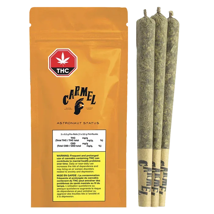 Front-facing shot of the orange Carmel Astronaut Status PR 3 x 0.5 g pouch beside three rolled joints standing upright on a white background