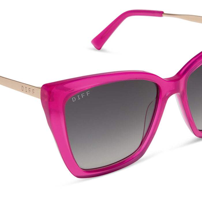 diff eyewear featuring the becky ii cat eye sunglasses with a bright pink tulip & gold frame and grey gradient polarized lenses detailed view