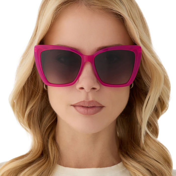 on model - blonde female wearing diff eyewear featuring the becky ii cat eye sunglasses with a bright pink tulip & gold frame and grey gradient polarized lenses front view