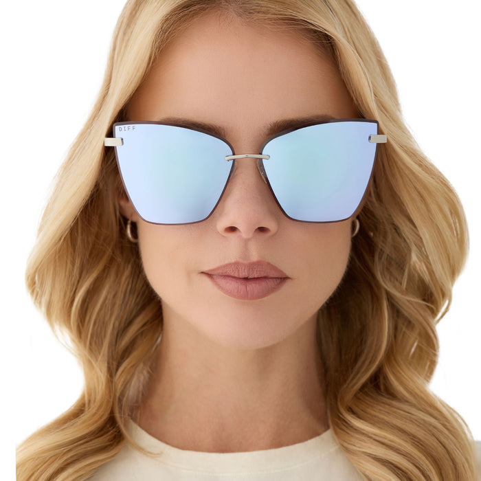 on model - female wearing diff eyewear featuring the becky v cat eye sunglasses with a silver frame and lavender mirror lenses front view