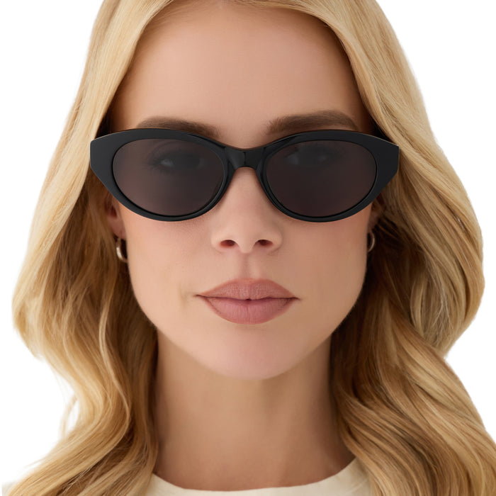 on model - blonde female wearing yellowstone x diff eyewear featuring the teeter round sunglasses with a classic black acetate frame and grey polarized lenses front view