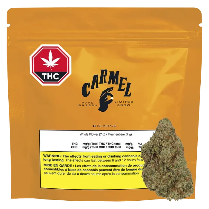 Front view of the golden Carmel Big Apple pouch with THC symbol and a cannabis bud photographed at its lower right.