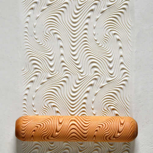 MKM Big Hand Roller BHR-79 Psychedelic Wave on a clay slab impressed with flowing, swirling wavy lines