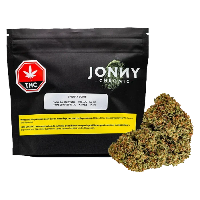 Front-facing shot of a black pouch and a 28 g bud pile labeled Jonny Chronic Cherry Bomb against a white background.