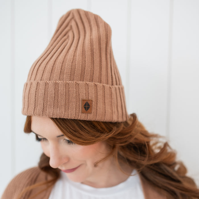 Chunky Knit Adult Ribbed Beanie in Latte shown on a female model