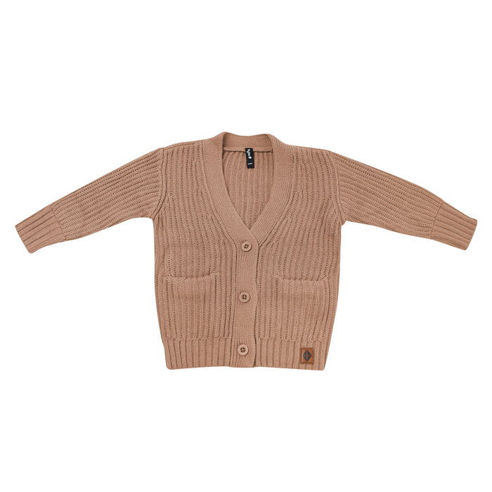 Chunky Knit Oversized Cardigan in Latte shown buttoned up with the side pockets and Kyte Baby vegan leather tag visible