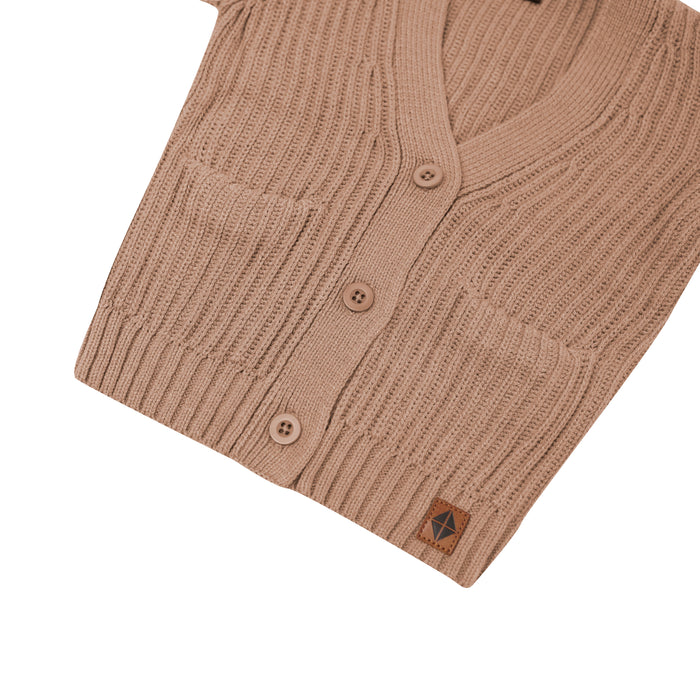 Close up of the button closures and side pockets of the Chunky Knit Oversized Cardigan in Latte