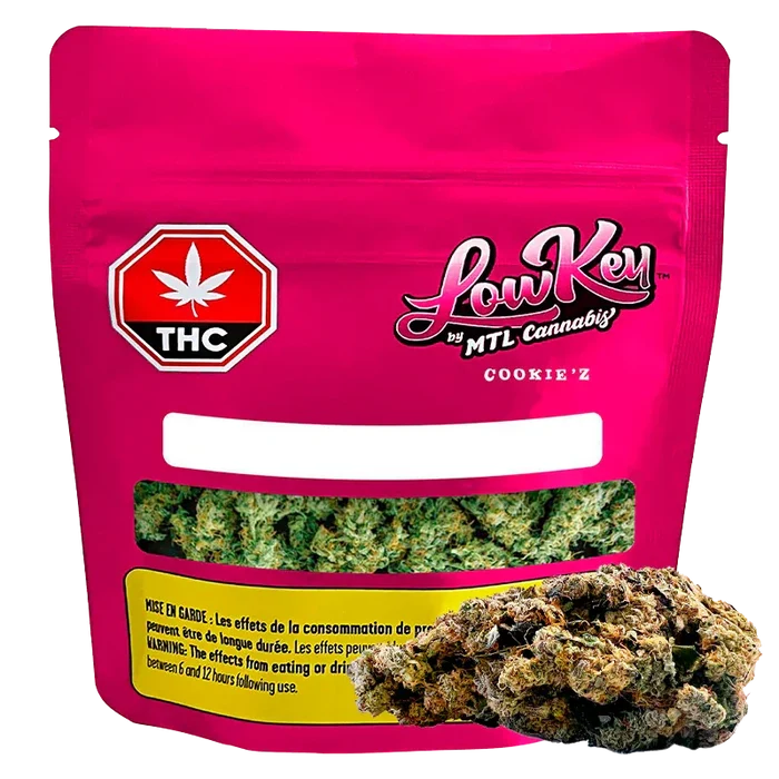 Front-facing pouch shot of the bright pink Cookie'z package by LowKey with a clear window showing green buds and a THC symbol.