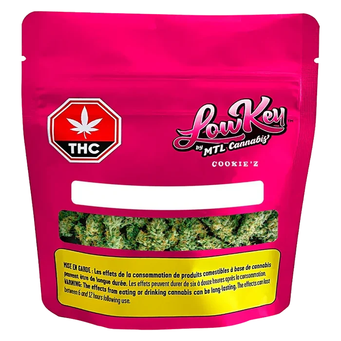 Front-facing pouch of Cookie'z by LowKey showing a bright magenta package with a THC symbol and a clear window revealing green cannabis buds.