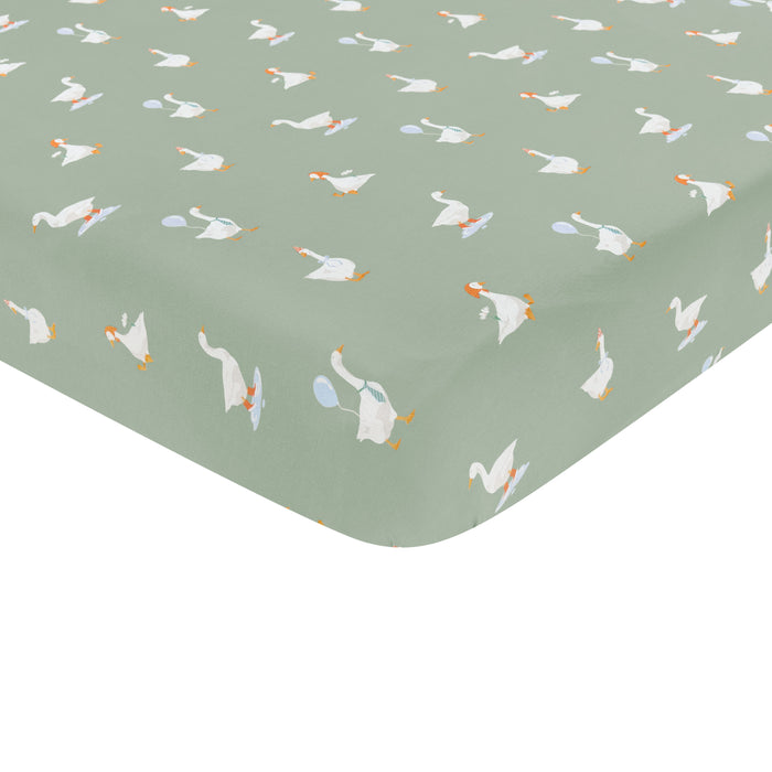 Corner of the Crib Sheet in Silly Goose shown on a crib mattress