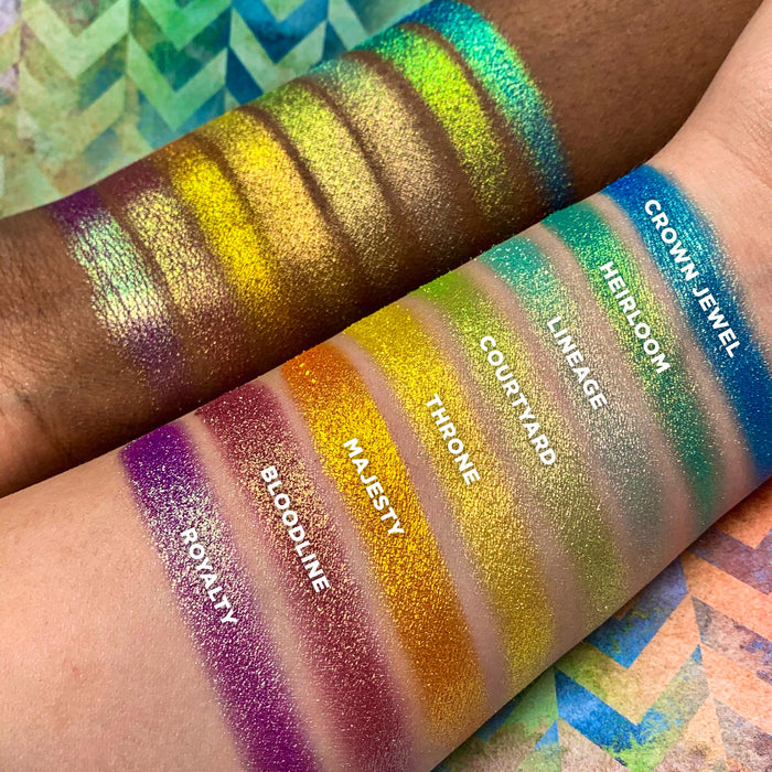 Right angled arm swatches on fair and deep skin tones of Crown Jewel Vibrant Multichrome Eyeshadow shifts in Vibrant Multichrome bundle with Heirloom, Lineage, Courtyard, Throne, Majesty, Bloodline, Royalty