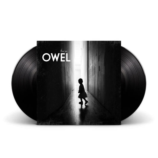 This limited double LP Dear Me vinyl by OWEL showcases a cover with a child’s silhouette in a dark hallway and features white band and album text at the top left, making it a uniquely collectible edition.