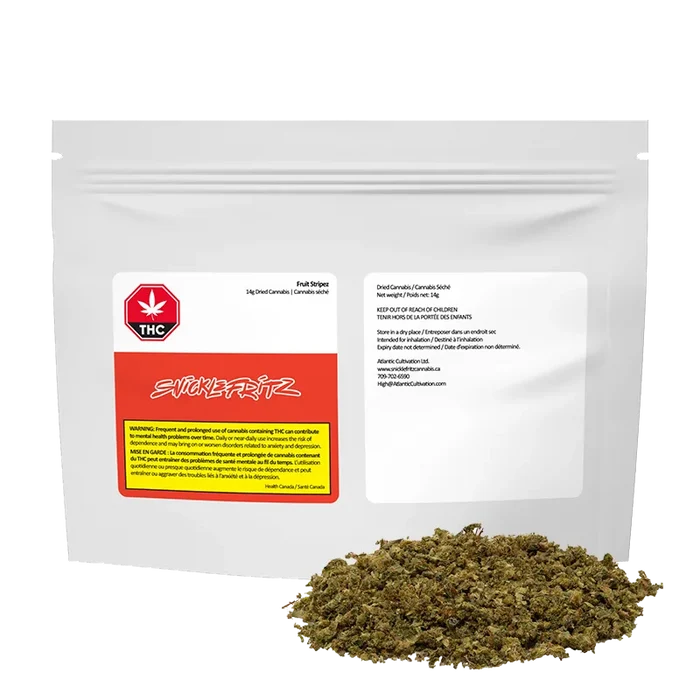 White resealable pouch photographed front-on with a pile of loose green-brown herb at its base, labeled Fruit Stripez.