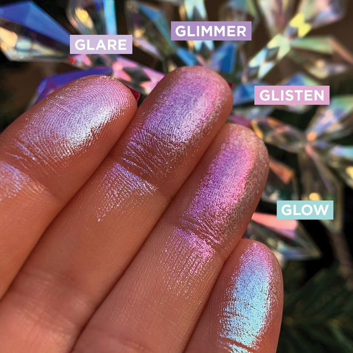Low angled finger swatches on fair skin tone of Glimmer Glitter-Type Iridescent Multichrome Eyeshadow shifts compared to Glare, Glisten, Glow