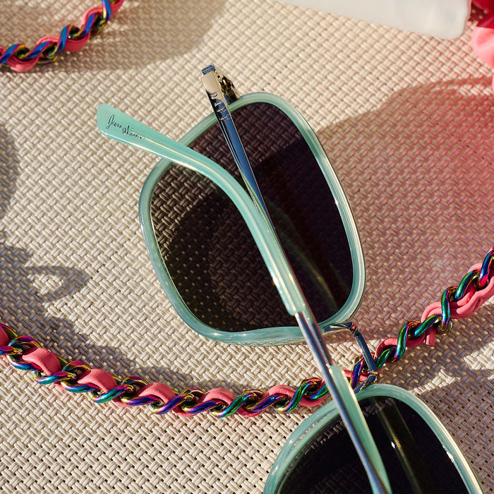 still life - jena sims x diff eyewear  hope cat eye sunglasses with a bronco blue frame and grey gradient polarized lenses detailed view