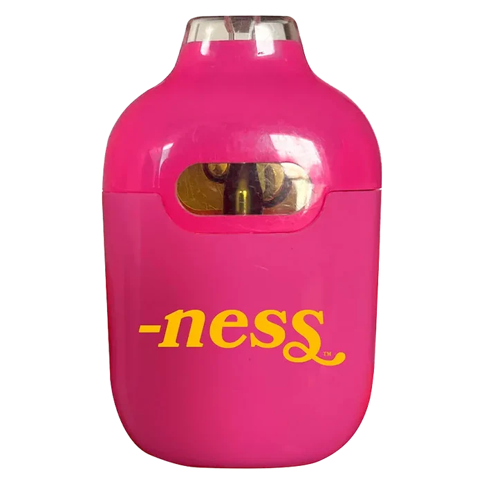 Close-up front view of a bright pink Iced Peachy Mango Disposable Vape showing its rounded top mouthpiece, small oval juice window, and yellow "-ness" logo.