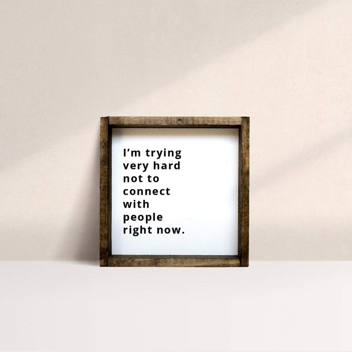 I'm trying very hard not to connect with people right now wooden sign
