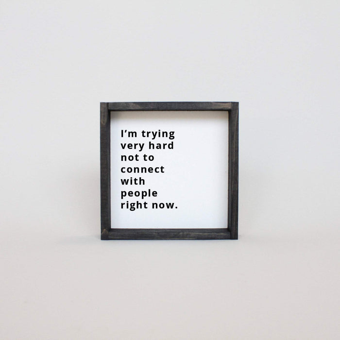 I'm trying very hard not to connect with people right now hanging sign