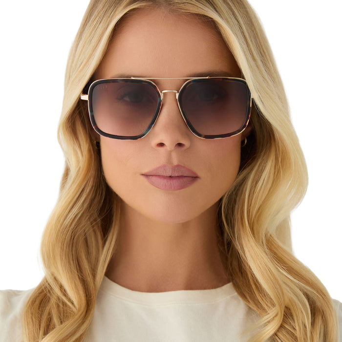 on model - female wearing diff eyewear featuring the jordan navigator sunglasses with a confetti tortoise frame and brown gradient lenses front view