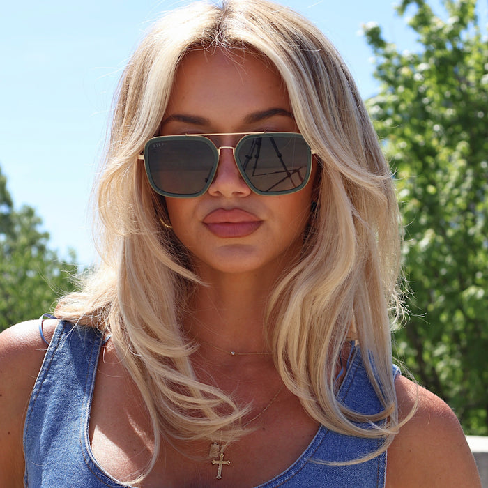 lifestyle - ashley smith wearing green navigator sunglasses with gold frame