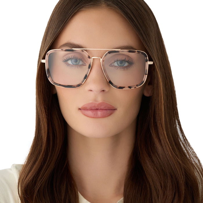 on model - female wearing diff eyewear featuring the jordan navigator prescription glasses with a himalayan tortoise and gold metal frame front view