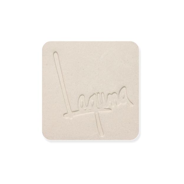 Laguna B-Mix 10 (WC379) clay test tile, smooth cream-white square with an impressed Laguna logo