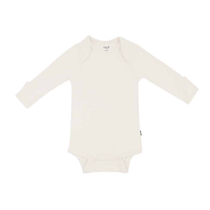 Flat lay of Kyte Baby Long Sleeve Bodysuit in Oat