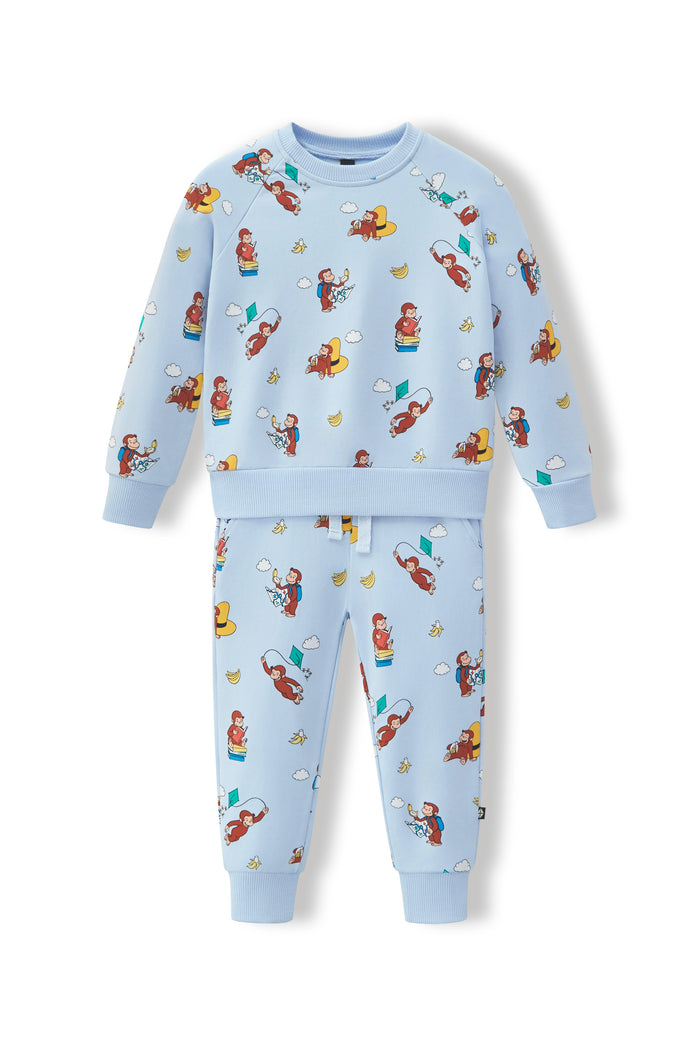A two-piece kids' sweatshirt and jogger pants set in light blue, featuring an all-over cartoon monkey print, displayed on a clean white background.