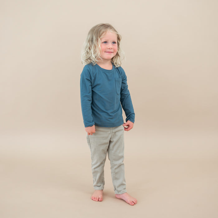 Toddler wearing the Long Sleeve Toddler Crew Neck Tee in Atlantic paired with jeans