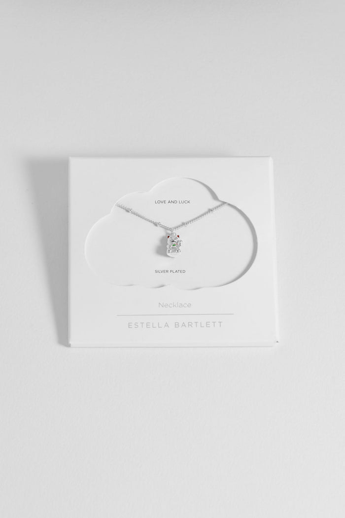Necklace with a pendant on a white card with 'Estella Bartlett' branding on a light gray background