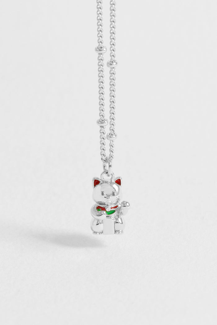 Silver cat-shaped pendant necklace on a white background