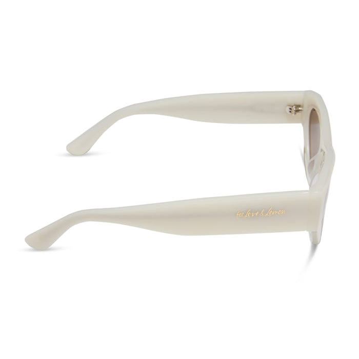 for love & lemons x diff eyewear featuring the lucy cat eye sunglasses with a meringue acetate frame and brown gradient lenses side view