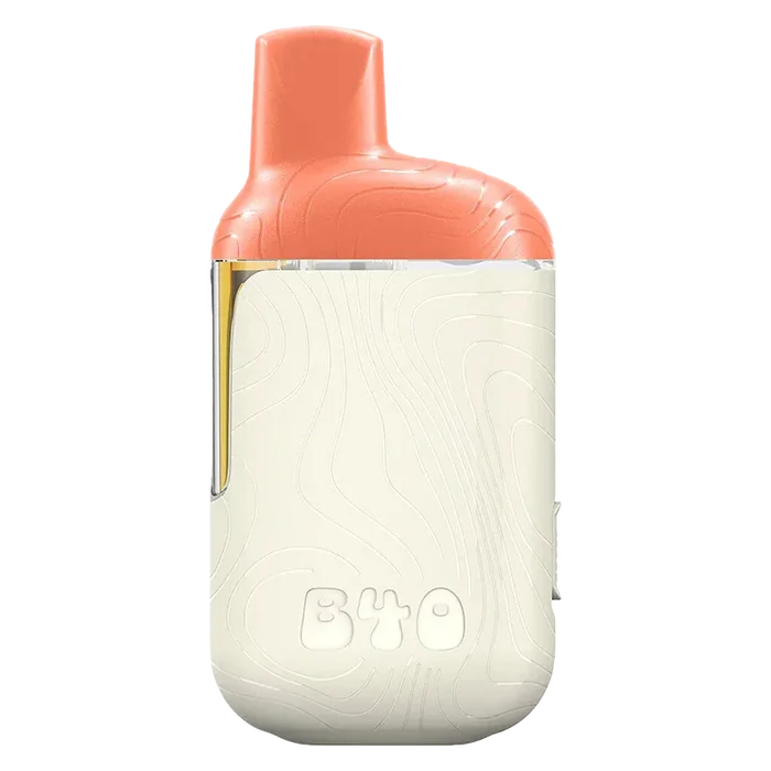 Three-quarter front view of the Mango Fuzz BOOSTED Disposable Vape showing its coral mouthpiece and cream textured body with a visible juice window.