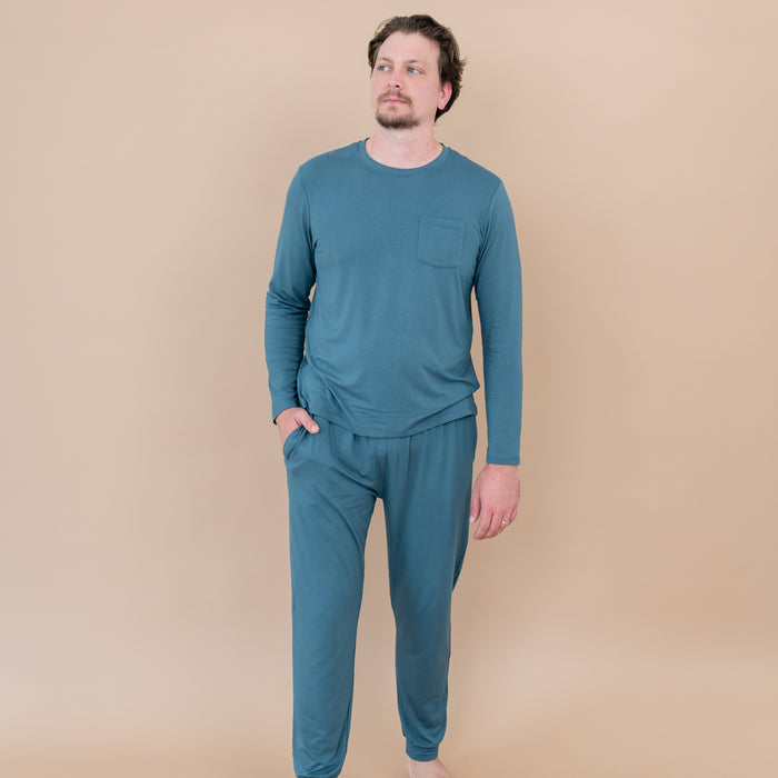 Male model walking wearing the Men's Jogger Set in Atlantic with one hand in his jogger pant pocket