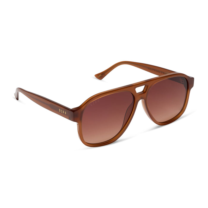 jessie james decker x diff eyewear featuring the nash navigator sunglasses with a milk caramel frame and brown gradient lenses angled view