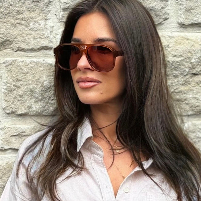 on model - jessie james decker wearing diff eyewear nash navigator sunglasses with a milk caramel frame and brown gradient lenses angled view