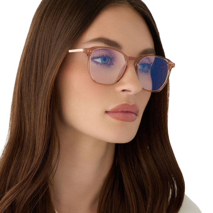 on model - female wearing diff eyewear featuring the noel round prescription glasses with a  brown café ole frame angled view