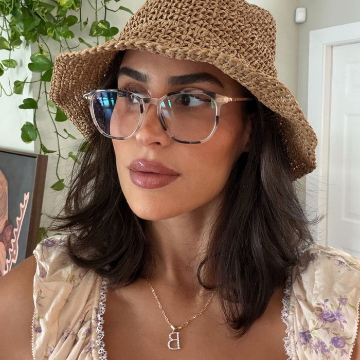 lifestyle - rachel bonsike wearing cream tort noel round eyeglasses with weaved bucked hat