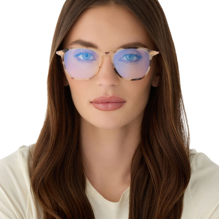 on model -female wearing diff eyewear featuring the noel round prescription glasses with a cream tortoise frame front view