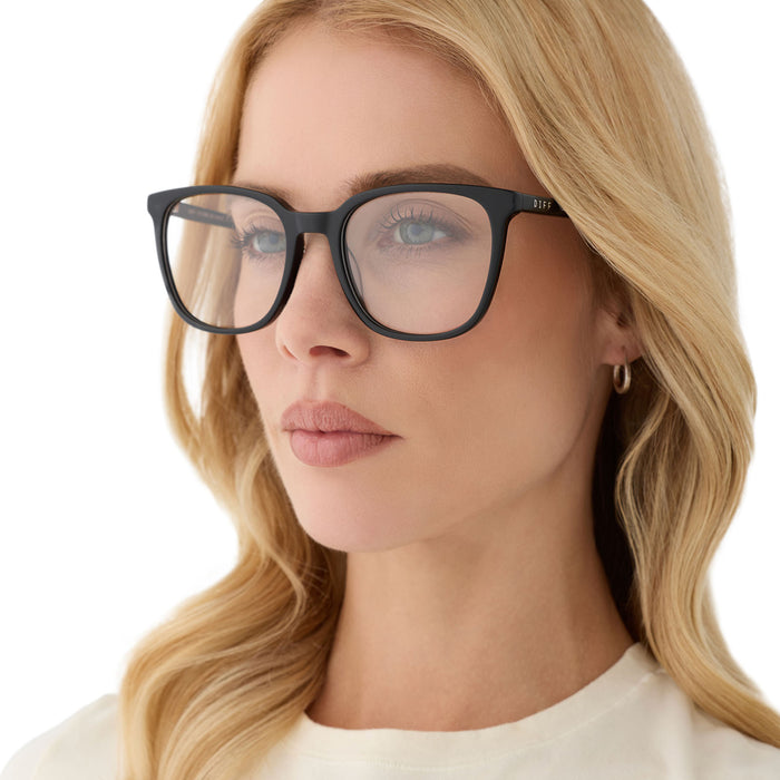 on model - female wearing diff eyewear featuring the parker square blue light technology glasses with a black frame angled view
