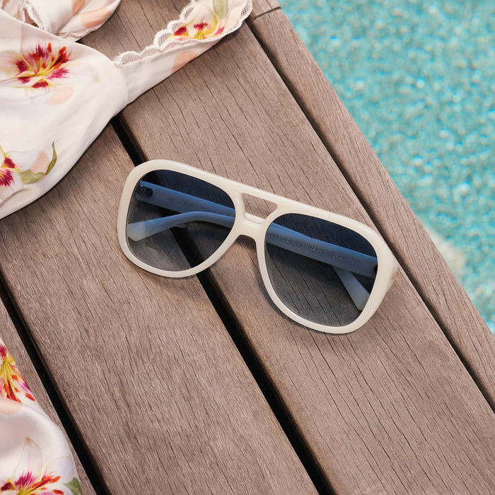 still life - diff eyewear x for love & lemons pauline sunglasses next to pool