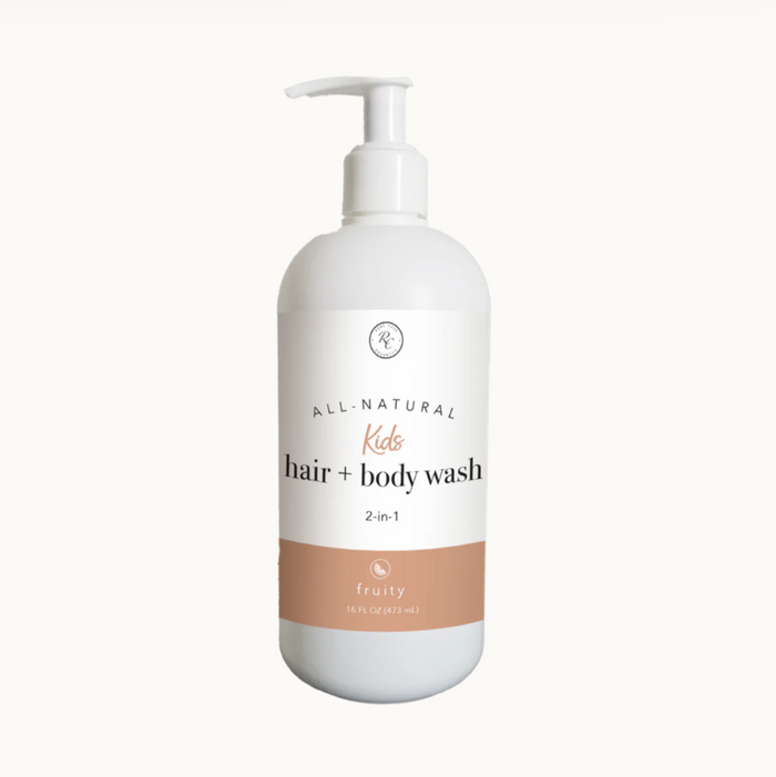 A white pump bottle labeled 'All Natural Kids Hair + Body Wash 2-in-1 Fruity'